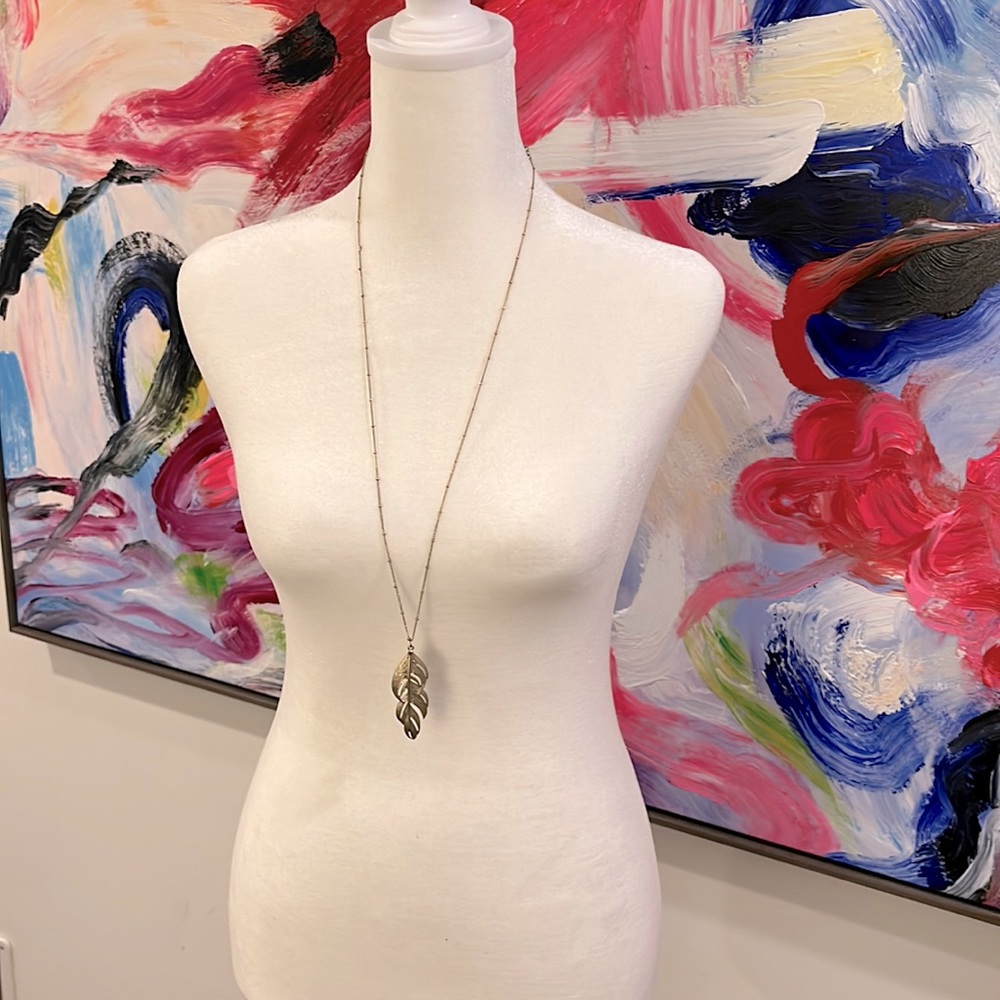 NWOT: faux gold leaf necklace. Perfect for colored blouse, scallop shirt.